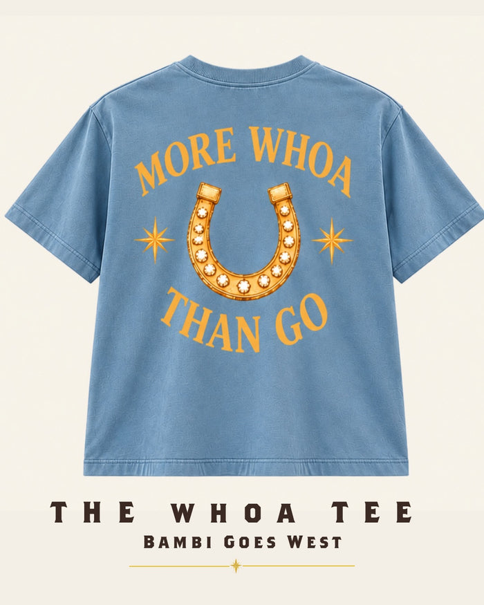 The More Whoa Than Go Tee in vintage denim, back: More Whoa Than Go around a gold horseshoe.
